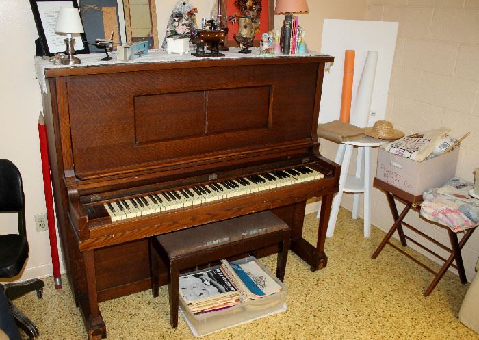 Pullman upright piano with bench, sheet music