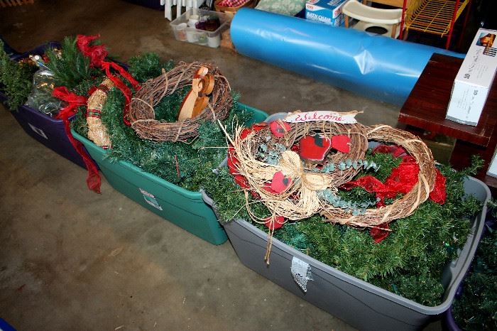Bins of garland / wreaths, large roll of blue plastic