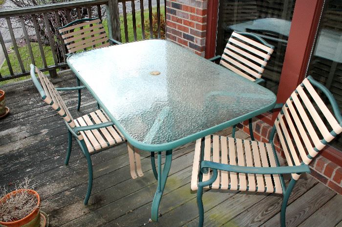 Outdoor glass-top table and chairs