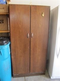 Brown Metal Cabinet with Garden Tools