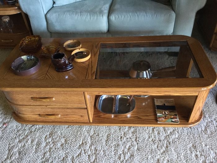 Coffee table, matches two end tables, on rollers, nice drawers for storage