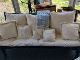 Blue Bench with white pillows.