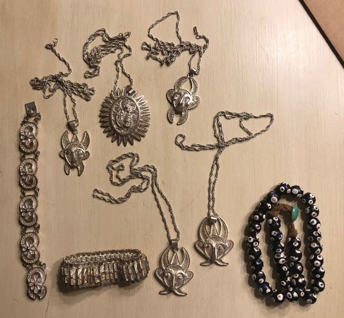 Vintage .900 silver handmade African jewelry sold by the gram.  Snake eye trade beads.