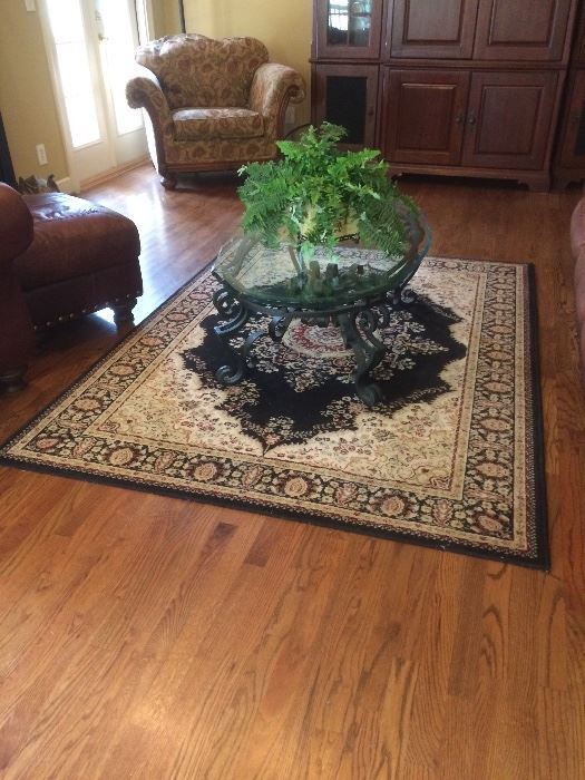 oval beveled glass and wrought iron coffee table (from Rich's) over area rug