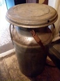 Milk can, has attached hose