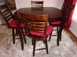 Counter height table and 4 swivel chairs with built in leaf excellent condition, Large neutral area rug