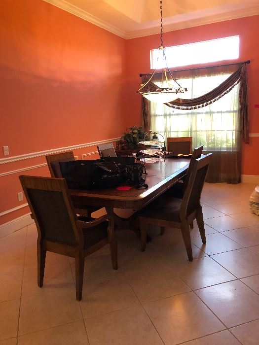 Large dining room set but 2 leafs can be taken out to make it smaller