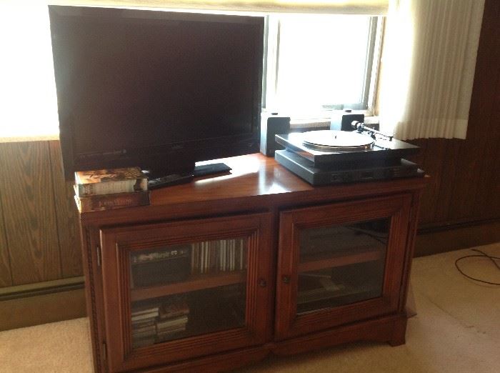 Flat screen TV, Denon turntable / receiver, entertainment cabinet 