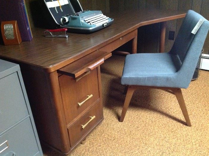 Vintage mid century desk, new moderne teal chair, vintage manual typewriter.