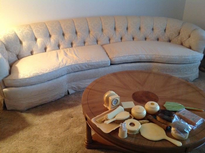 Tufted sofa , vintage dresser pieces.