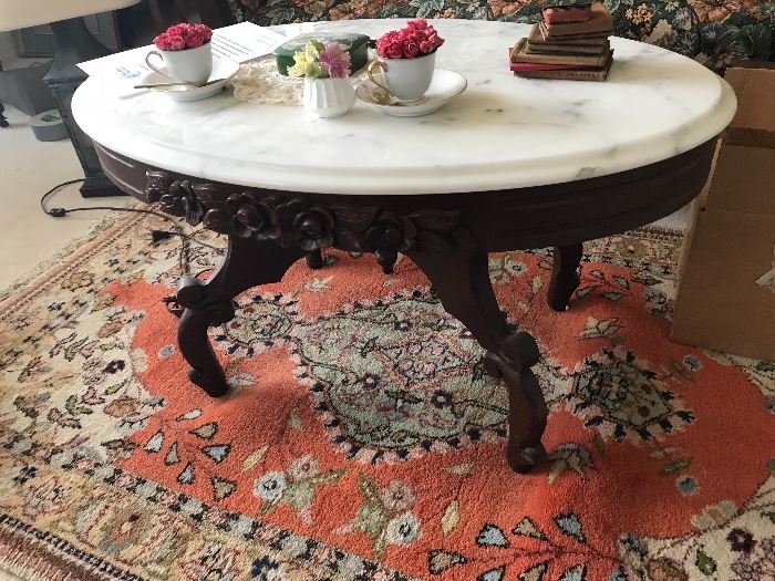 Marble top oval coffee table Table ONLY.  Small books on top are not for sale.