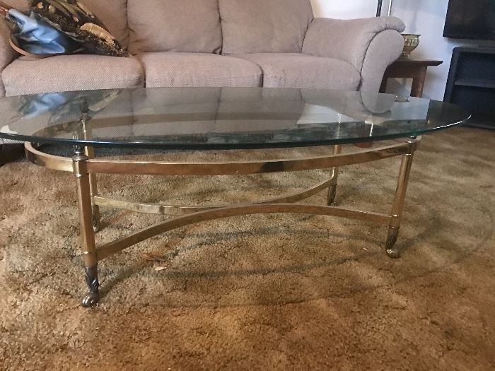 Beveled glass coffee table with brass stand. Very heavy