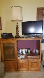 entertainment cabinet, lamp, dvds, cds, cassetes, Sharp LCD tv, VHS player, Blu-Ray player all with remotes