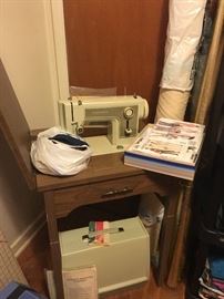 kenmore sewing machine and table and papers  also have  a few retro patterns, and sew notions 