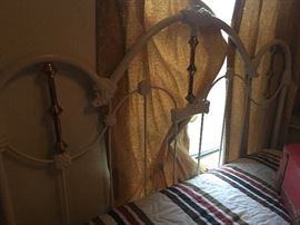 wrought iron  full size headboard  good weight to it -pretty old  and nice condition