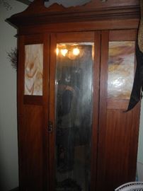 Antique armoire with slag glass inserts plus mirror