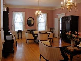 Mahogany, Large armoire, round table with barrel chairs, twin love seats, plant stands, and secretary desk