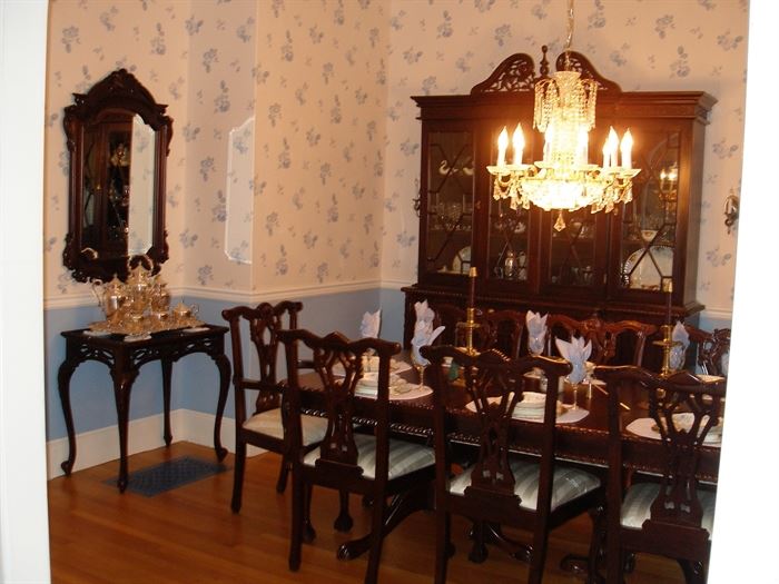 Mahogany Tea Table, matching mirro, large mahogany china cabinet, pedastal dining table (seats 12 people), 12 matching chippendale chairs.