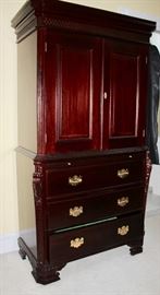 Armoire with pull out writing table and drawers