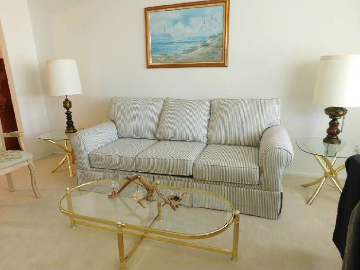 living room furniture includes sofa and brass and glass coffee table set (matching love seat in back room)