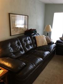 Leather look couch, love seat and ottoman.