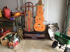 Work table, sled, pumpkin decoration, beer barrel cut in half,spreader,gas cans,bags and washer game
