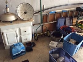 Porcelain lights, cabinet, push mower  not for sale is the aluminum extension ladder