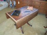 This dining room drop leaf drops down to a cocktail/coffee table! Despite the cosmetic condition, you just don't see these anymore!!