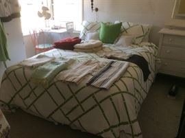 Bed, bedding, throw rugs