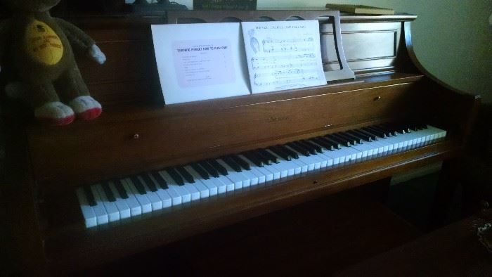 Thomas brand upright piano.