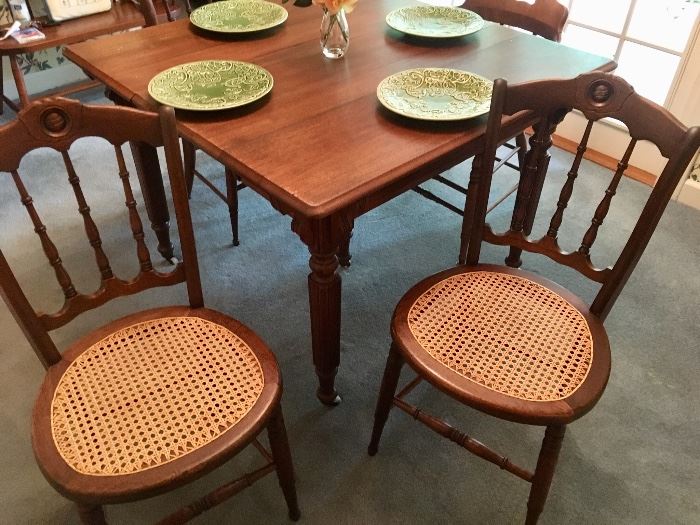 Antique oak table (approx 41” square) with cane seat chairs (priced separately)