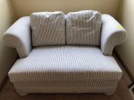 small love seat with a fold out twin bed