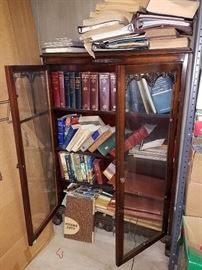 Books and antique bookcase