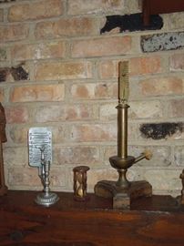 Late 19th century small sandglass, pewter reproduction of a candle burning clock, ca. 1975 Italian brass and distressed wood replica of an oil-burning clock.