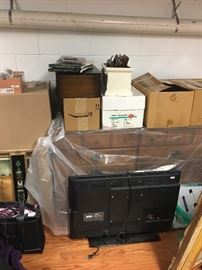 Boxes of collectibles & a dresser 
