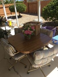 Kitchen table w/5 rolling chairs