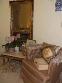 Tufted club chair and pier mirror