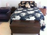 Quilted bedspread with matching spread queen bed, cedar chest, and nightstand
