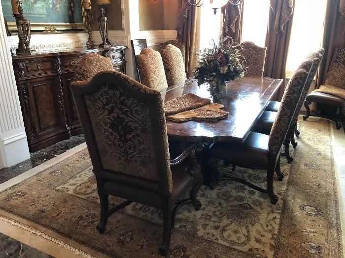 Tremendous large distressed look farm style table with 10 nailhead upholstered chairs and matching sideboard