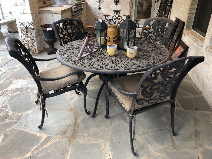 Scrolled wrought iron patio table with 4 chairs