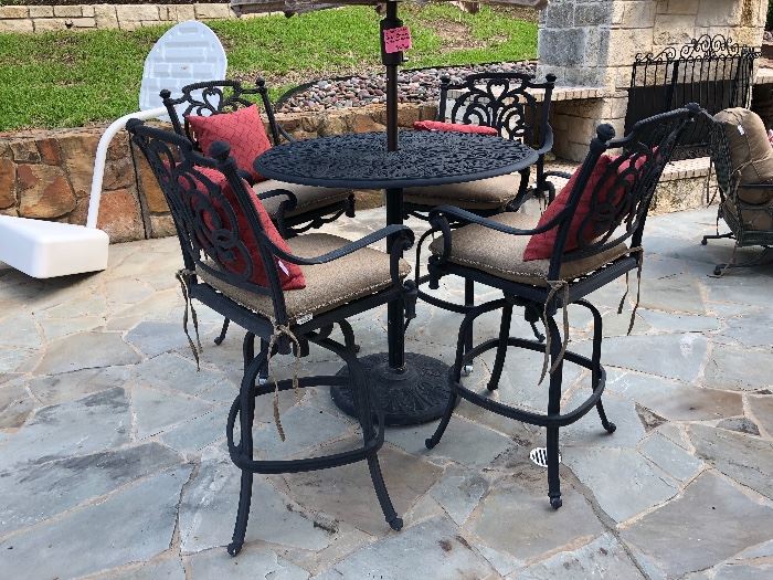 Scrolled wrought iron pub table with umbrella