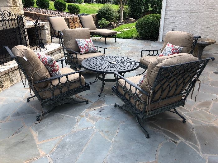 Nice scrolled wrought iron patio chairs with new cushions and table