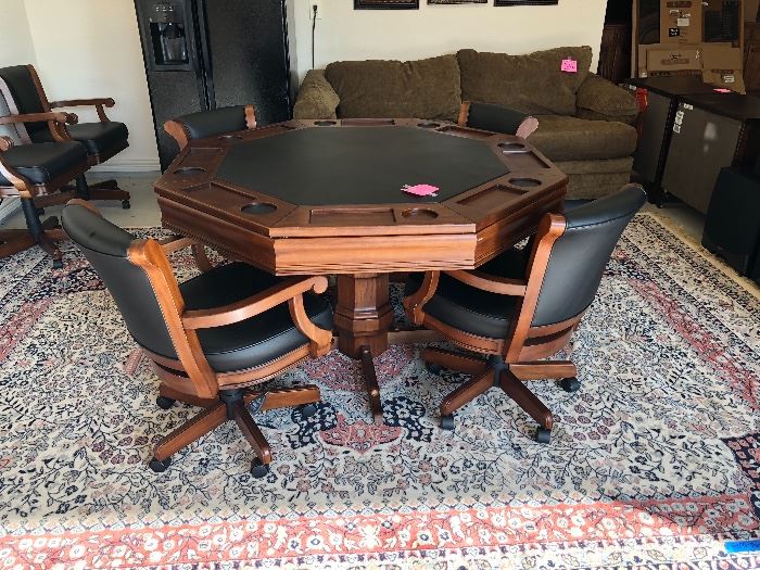 Very nice game table with 6 chairs. Table can be used as a table or game table.