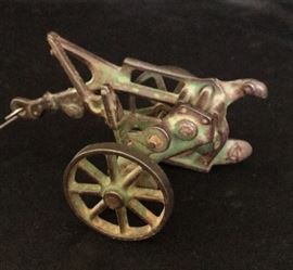 Vintage toys including this Allis Chalmers plow