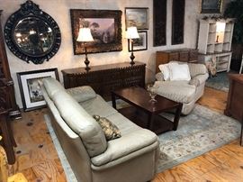 Nice leather couch and comfy chair and ottoman.