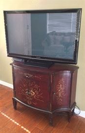 Flat Screen TV and Wooden Cabinet.