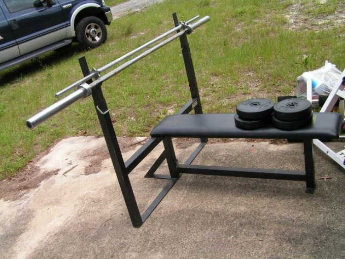 weight bench with 2 different bars,  weights are in  2 other photos