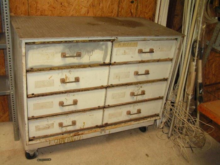 industrial 8 drawer metal cabinet on wheels also in corner are boat antennas
