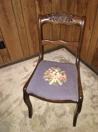 Antique chair with embroidered seat cushion