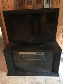 Flat screen TV and stand; DVR player/recorder